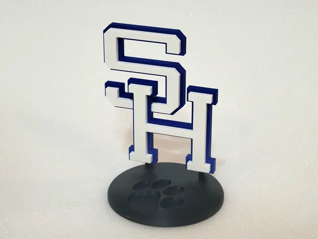 SH varsity-letter logo statuette with paw-print base